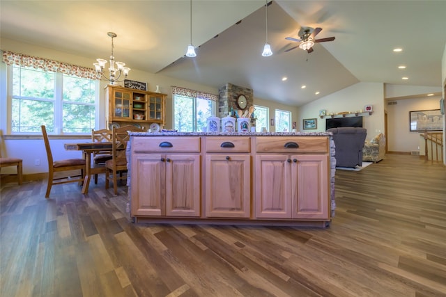 10487 Coulter Pine St, Lolo, MT 59847 - kitchen featuring dark wood-style flooring, a chandelier, ceiling fan, vaulted ceiling, and decorative light fixtures