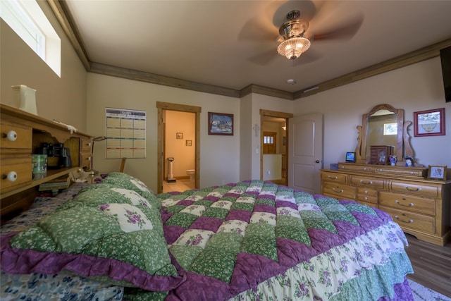 10487 Coulter Pine St, Lolo, MT 59847 - bedroom with wood finished floors, crown molding, and ceiling fan