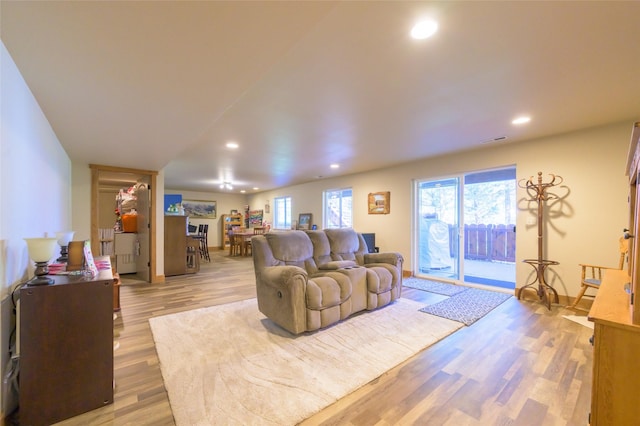 10487 Coulter Pine St, Lolo, MT 59847 - living room featuring light wood-style floors and recessed lighting