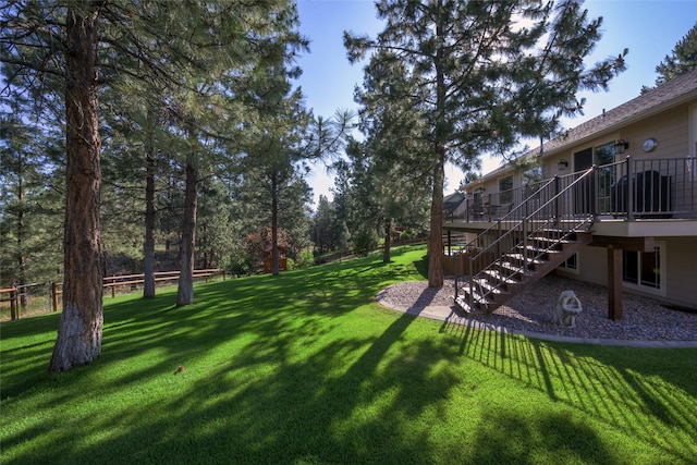10487 Coulter Pine St, Lolo, MT 59847 - view of yard with stairs and a wooden deck