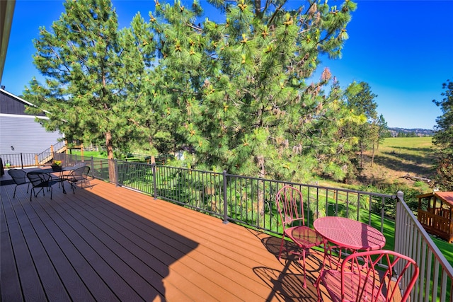 10487 Coulter Pine St, Lolo, MT 59847 - wooden terrace featuring outdoor dining space