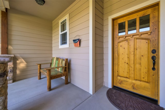 10487 Coulter Pine St, Lolo, MT 59847 - entrance to property featuring a porch