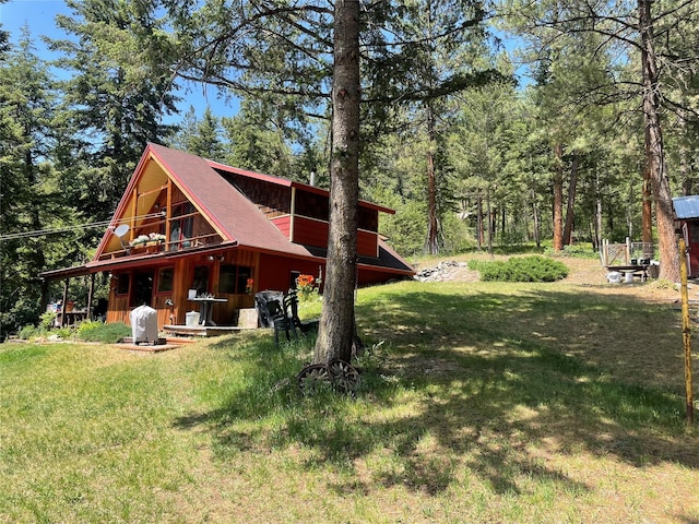 22550 Hill Rd, Clinton, MT 59825 - rear view of property featuring a yard