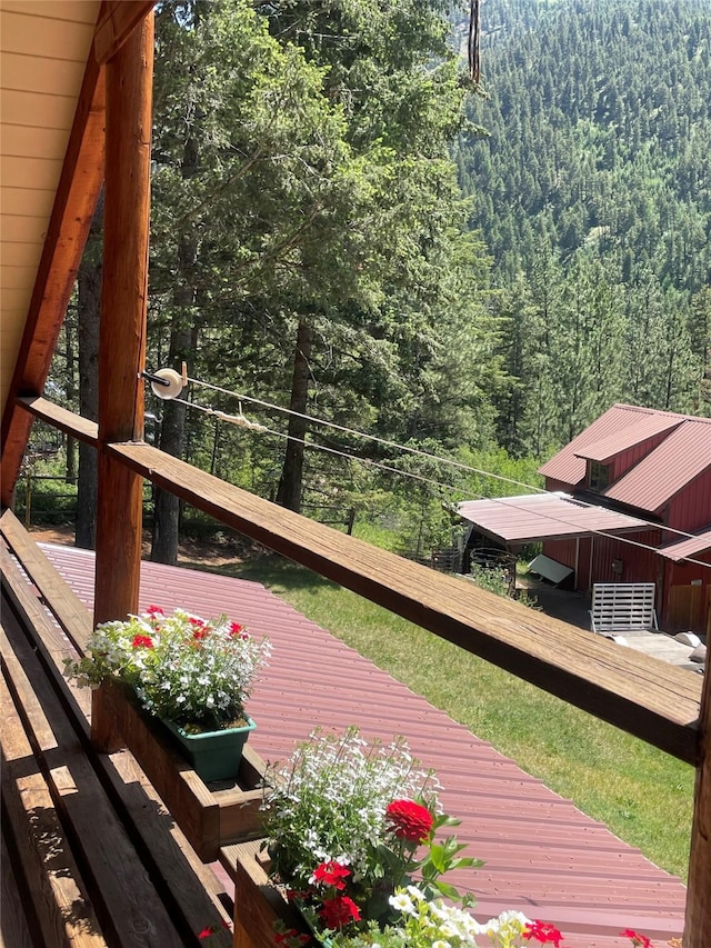 22550 Hill Rd, Clinton, MT 59825 - wooden deck with a forest view