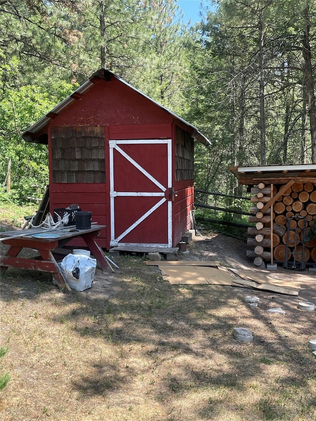 22550 Hill Rd, Clinton, MT 59825 - view of shed with a forest view
