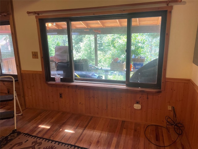22550 Hill Rd, Clinton, MT 59825 - detailed view of a wainscoted wall, wooden walls, and wood finished floors