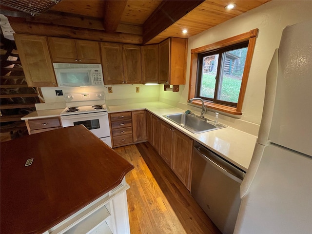 22550 Hill Rd, Clinton, MT 59825 - kitchen with white appliances, light wood-style floors, a wood ceiling with exposed beams, recessed lighting, and brown cabinets