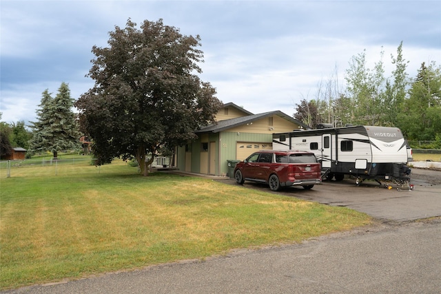51 Konley Dr, Kalispell, MT 59901 - view of property exterior featuring an attached garage and asphalt driveway
