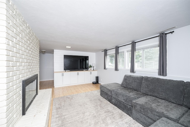 51 Konley Dr, Kalispell, MT 59901 - living area featuring light wood-style flooring and a fireplace