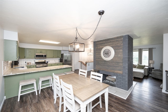 51 Konley Dr, Kalispell, MT 59901 - dining space featuring dark wood-style flooring and baseboards