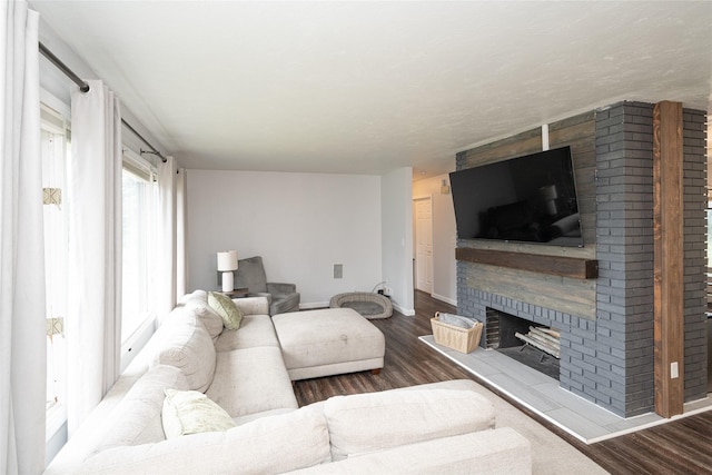 51 Konley Dr, Kalispell, MT 59901 - living area with a brick fireplace and wood finished floors