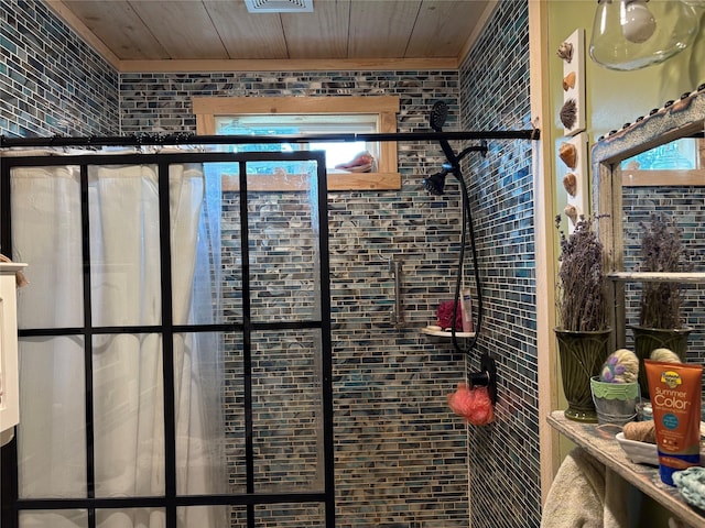 27687 Yaak River Rd, Troy, MT 59935 - bathroom with a tile shower and wood ceiling