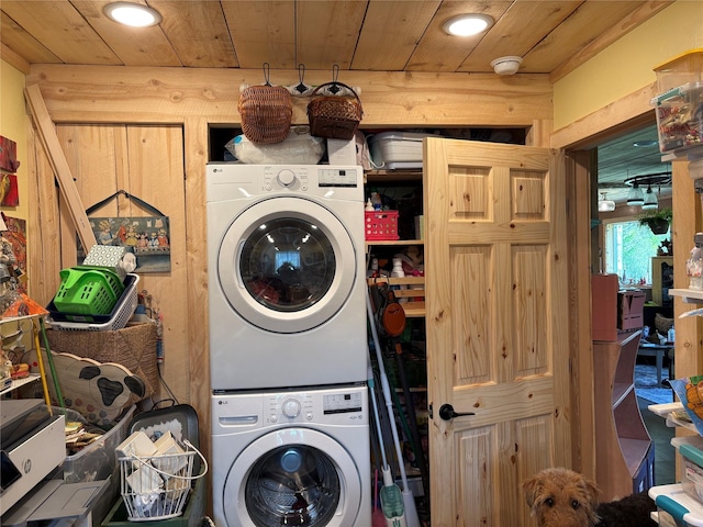 27687 Yaak River Rd, Troy, MT 59935 - washroom featuring stacked washer / dryer, wooden ceiling, and recessed lighting