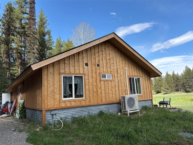 27687 Yaak River Rd, Troy, MT 59935 - view of side of property featuring a cooling unit and board and batten siding