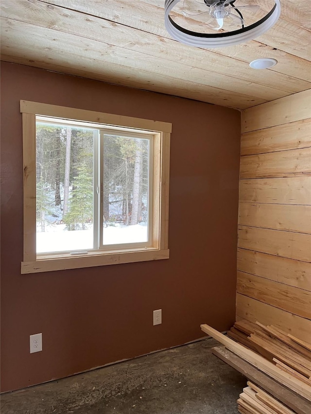 27687 Yaak River Rd, Troy, MT 59935 - unfurnished room with healthy amount of natural light and wooden walls