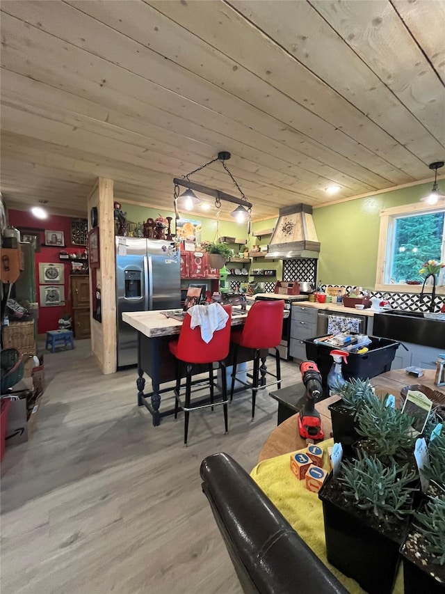 27687 Yaak River Rd, Troy, MT 59935 - dining room with wooden ceiling and light wood finished floors