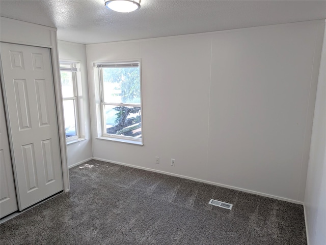 47 Merlin Dr, Bozeman, MT 59718 - carpeted empty room with a textured ceiling and baseboards