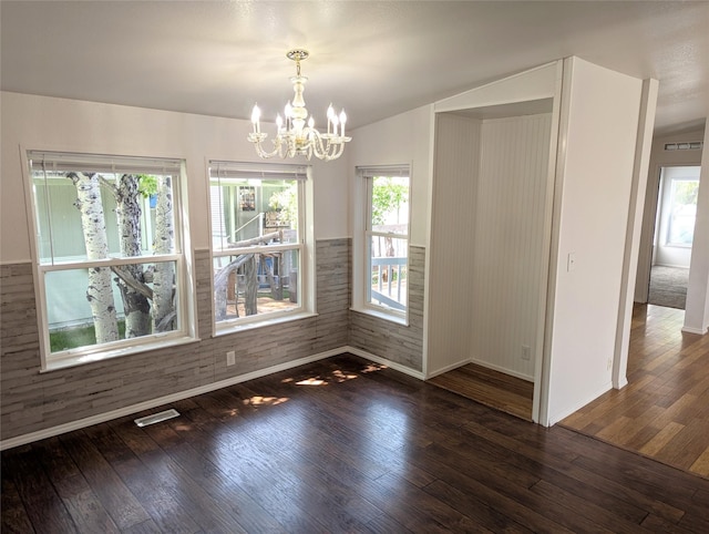 47 Merlin Dr, Bozeman, MT 59718 - unfurnished dining area featuring wood finished floors and a chandelier