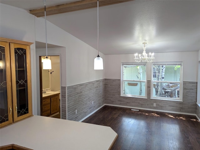 47 Merlin Dr, Bozeman, MT 59718 - unfurnished dining area featuring wainscoting, dark wood-type flooring, and a chandelier