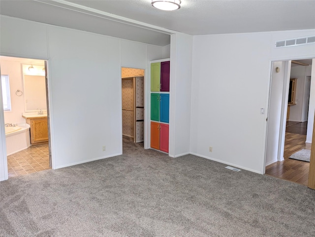 47 Merlin Dr, Bozeman, MT 59718 - unfurnished bedroom with carpet floors and ensuite bath