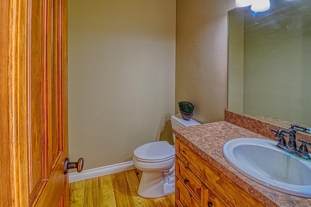 396 Wild Moose Springs Rd, Corvallis, MT 59828 - half bathroom featuring vanity and wood finished floors