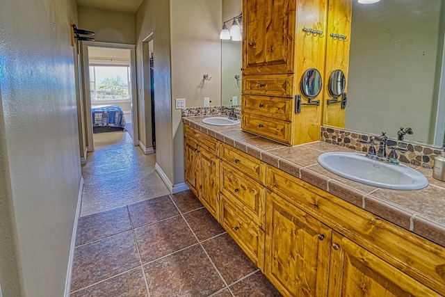 396 Wild Moose Springs Rd, Corvallis, MT 59828 - bathroom featuring double vanity and tile patterned floors