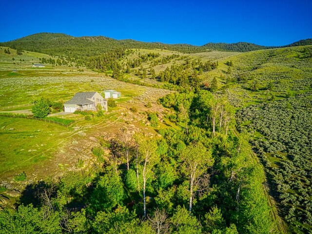 396 Wild Moose Springs Rd, Corvallis, MT 59828 - aerial view of property and surrounding area with a forest