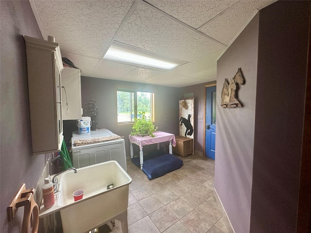 952 Chestnut Ave, Highwood, MT 59450 - laundry area with baseboards and light tile patterned floors