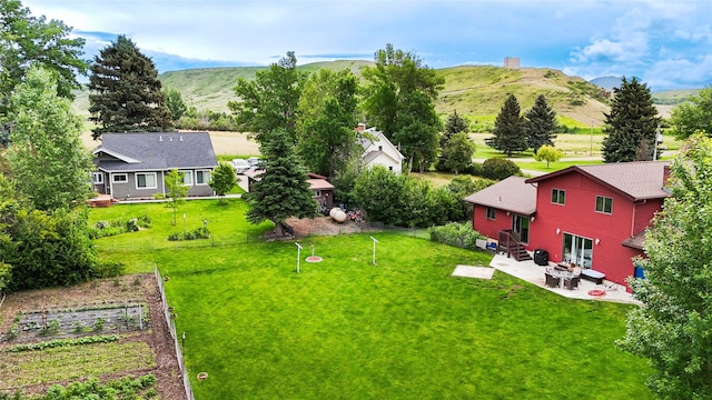 952 Chestnut Ave, Highwood, MT 59450 - view of green lawn featuring a patio and a mountain view
