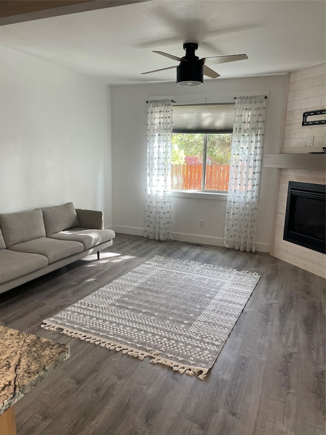 777 Aspen Grove St, Whitefish, MT 59937 - living room featuring ceiling fan, wood finished floors, and a fireplace