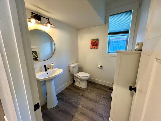 777 Aspen Grove St, Whitefish, MT 59937 - half bathroom featuring wood finished floors and toilet