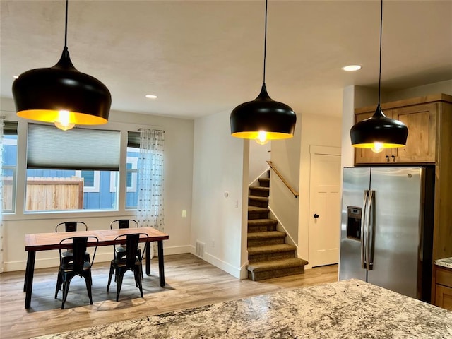 777 Aspen Grove St, Whitefish, MT 59937 - dining room with light wood finished floors, stairs, and recessed lighting