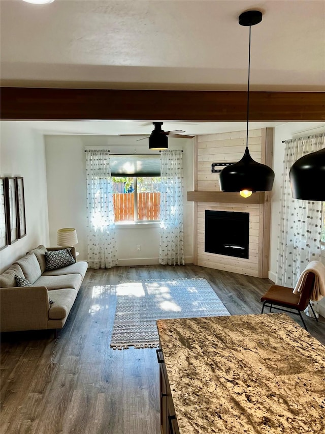 777 Aspen Grove St, Whitefish, MT 59937 - living area with wood finished floors, a fireplace, and a ceiling fan