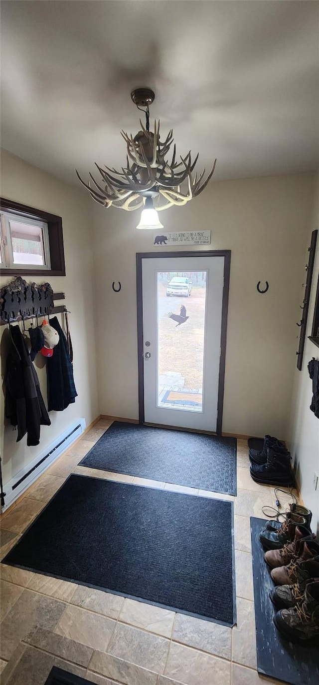9 Cross Ln, Plains, MT 59859 - foyer entrance with a baseboard heating unit and a chandelier
