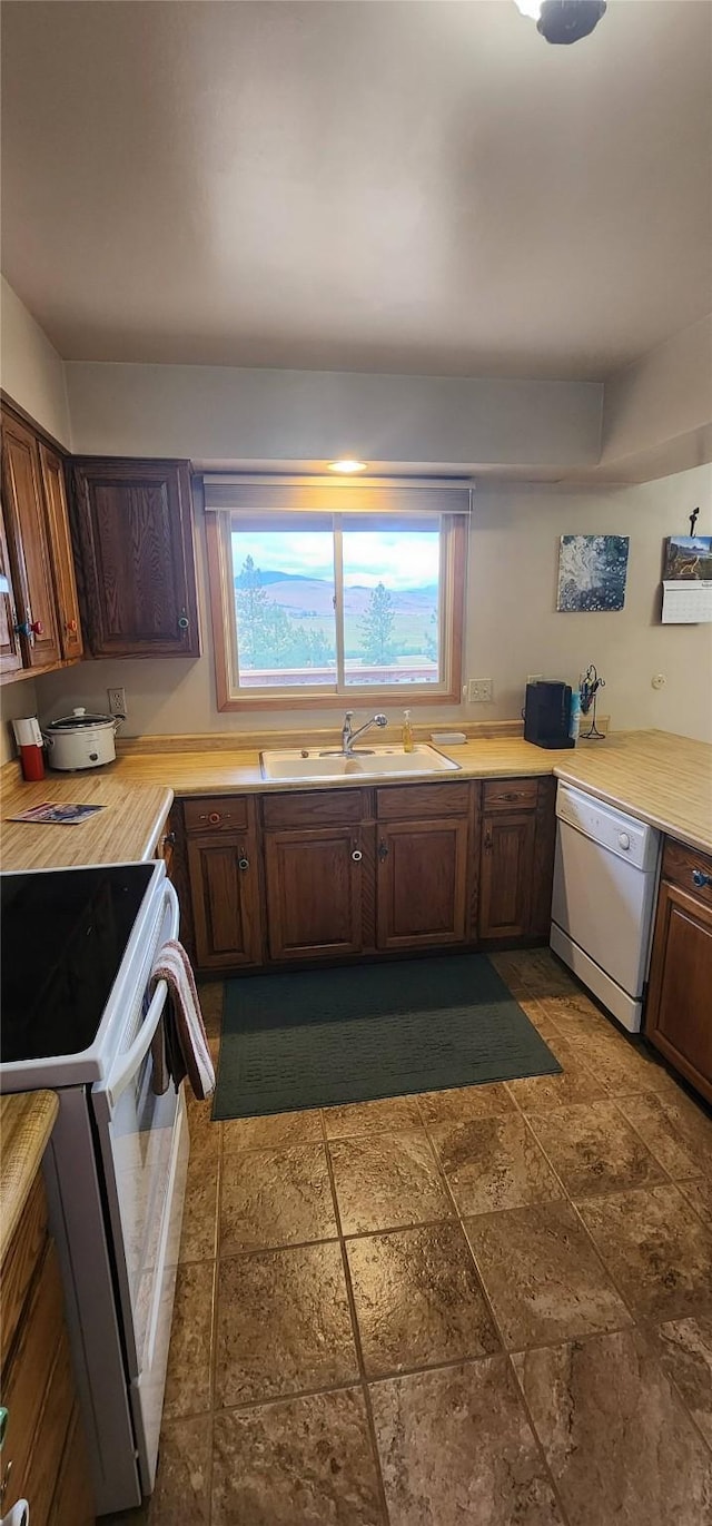 9 Cross Ln, Plains, MT 59859 - kitchen with white appliances, light countertops, and dark stone finish floors