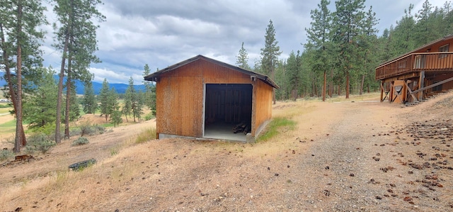 9 Cross Ln, Plains, MT 59859 - view of outbuilding featuring a mountain view, a wooded view, and dirt driveway