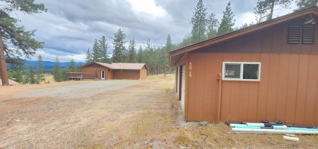 9 Cross Ln, Plains, MT 59859 - view of side of property with a mountain view and driveway