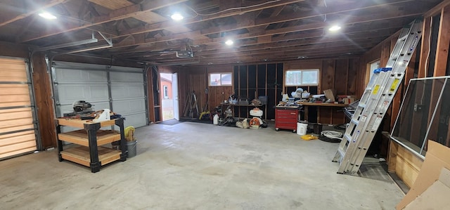 9 Cross Ln, Plains, MT 59859 - garage featuring a garage door opener and wood walls