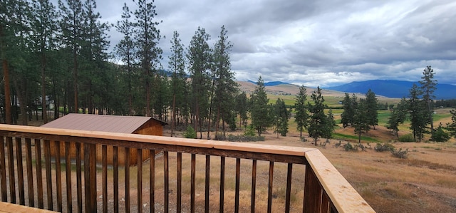 9 Cross Ln, Plains, MT 59859 - wooden deck featuring a mountain view and a view of rural / pastoral area