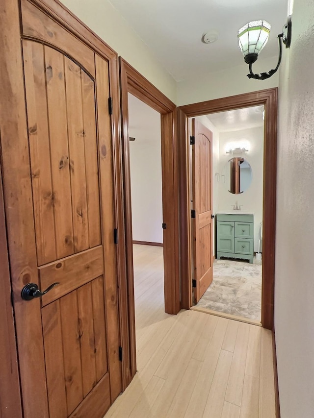 251 Elk Trl, Whitefish, MT 59937 - hallway featuring light wood finished floors and a sink