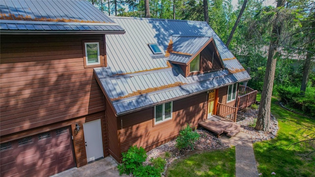 251 Elk Trl, Whitefish, MT 59937 - view of front of property with a standing seam roof, a metal roof, and an attached garage