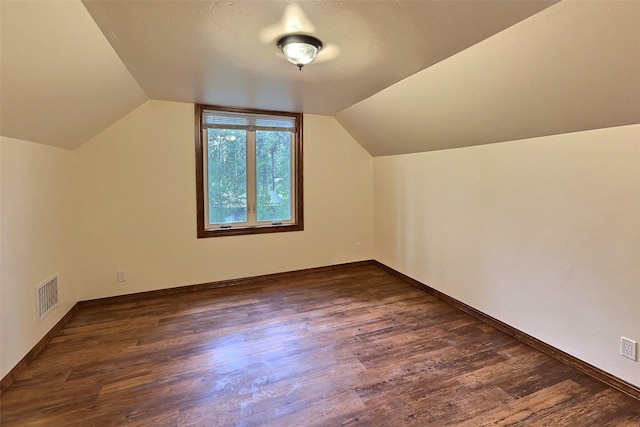251 Elk Trl, Whitefish, MT 59937 - additional living space featuring dark wood-style flooring and vaulted ceiling