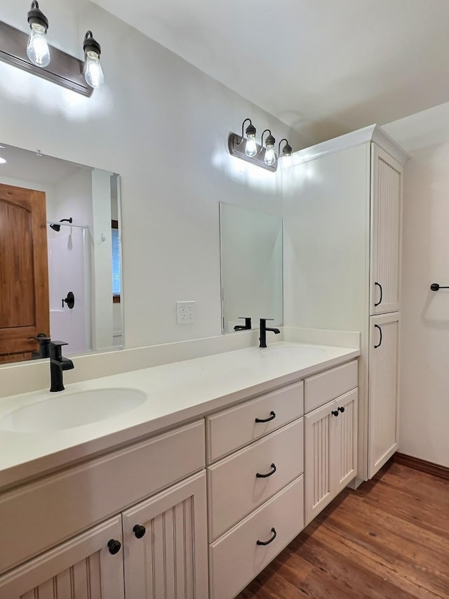 251 Elk Trl, Whitefish, MT 59937 - bathroom featuring double vanity and wood finished floors