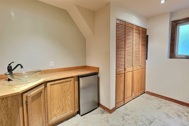 251 Elk Trl, Whitefish, MT 59937 - indoor dry bar featuring refrigerator and baseboards