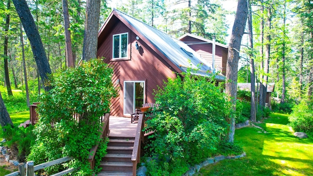 251 Elk Trl, Whitefish, MT 59937 - view of front of property featuring a deck and a front lawn