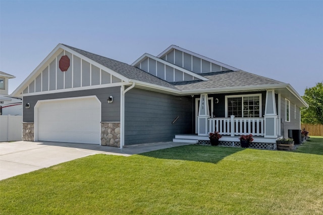 341 Northgate Loop, Helena, MT 59602 - view of front of home featuring board and batten siding, covered porch, an attached garage, roof with shingles, and concrete driveway