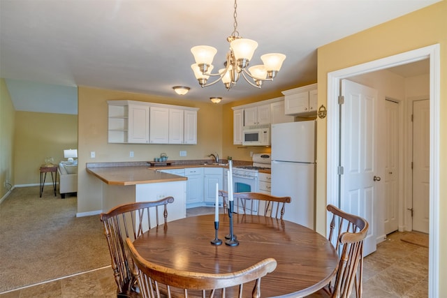341 Northgate Loop, Helena, MT 59602 - dining room featuring a chandelier and light carpet