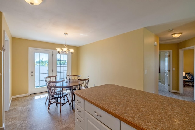 341 Northgate Loop, Helena, MT 59602 - dining space featuring a chandelier and baseboards