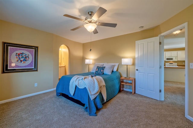 341 Northgate Loop, Helena, MT 59602 - bedroom with arched walkways, carpet, and a ceiling fan