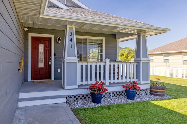 341 Northgate Loop, Helena, MT 59602 - doorway to property featuring roof with shingles and a porch